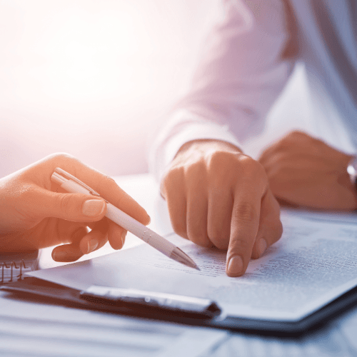Client signing Medicare documents guided by an advisor